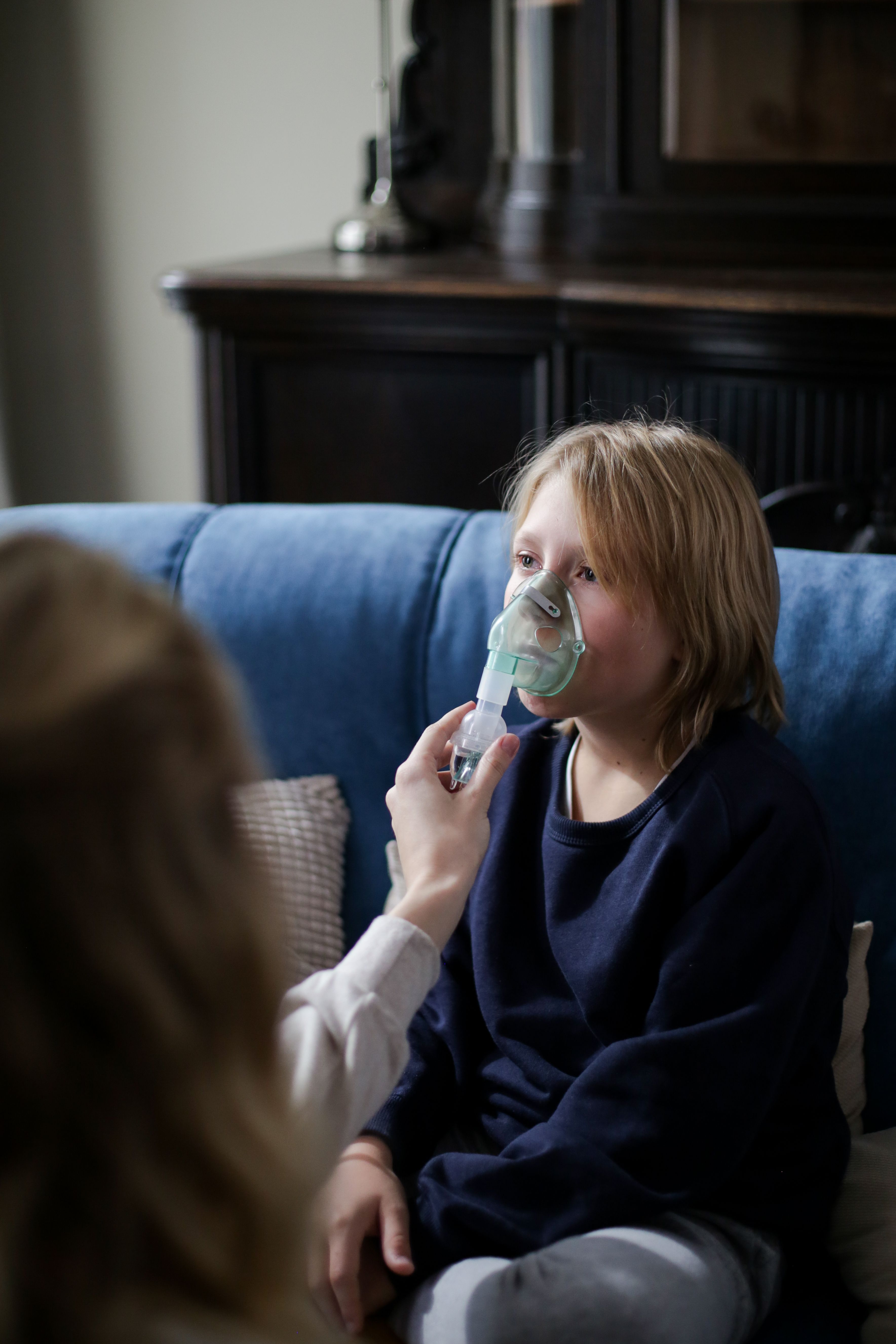 Child receiving emergency treatment — anaphylactic reaction response in schools